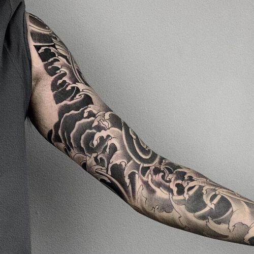 荷花鲤鱼纹身图片 荷花鲤鱼纹身图片手臂